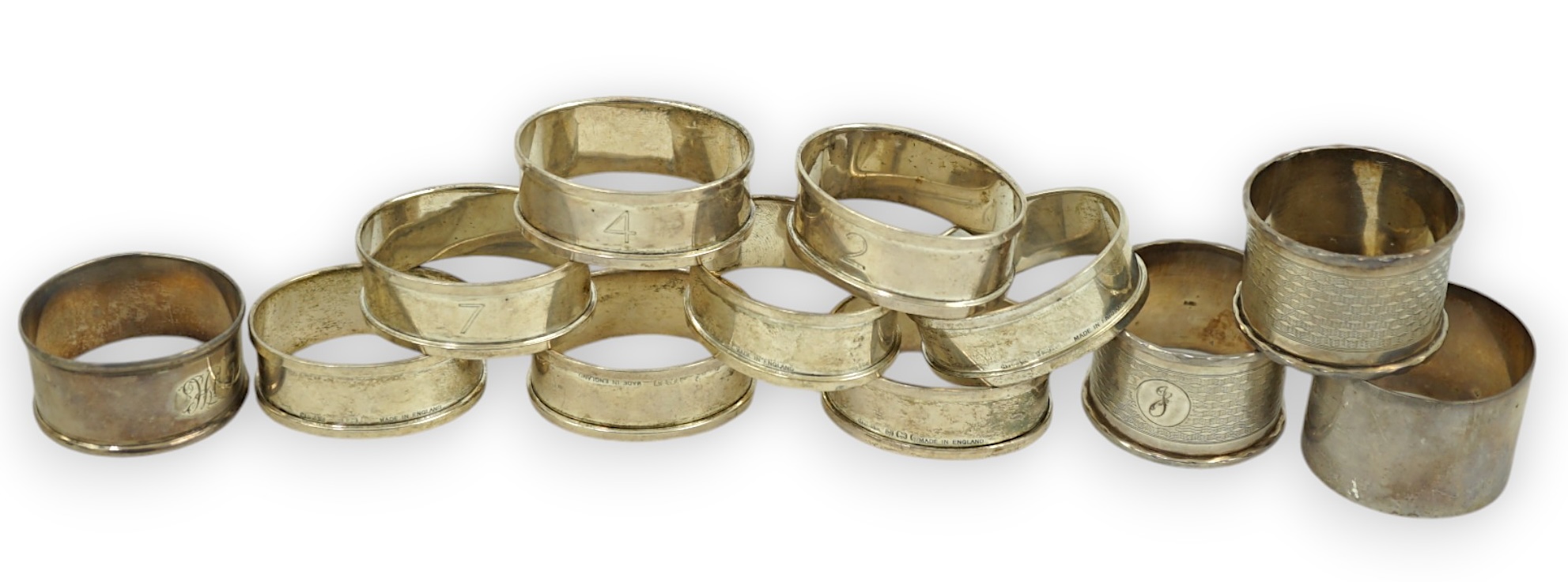 A matched set of eight early 1930's silver napkin rings and four other silver napkin rings including a pair, Birmingham, 1929, 5.3oz.